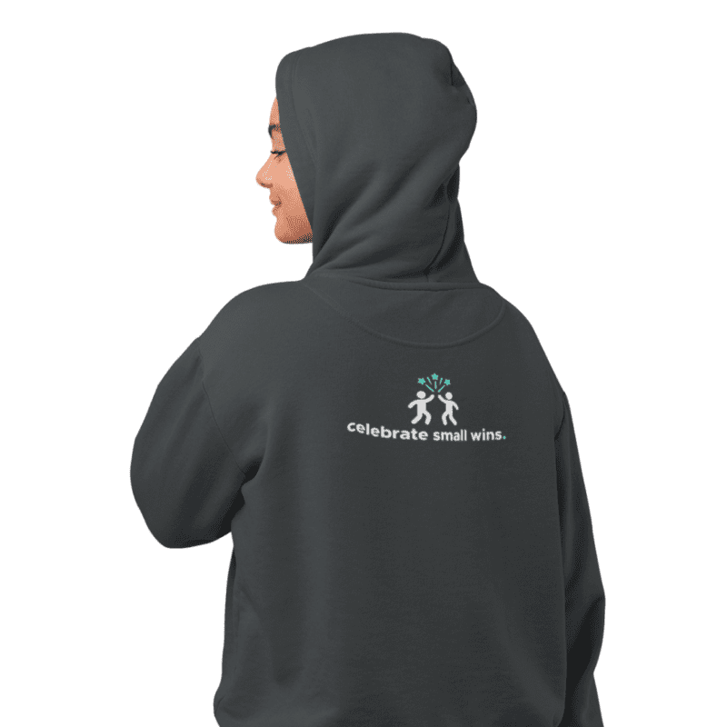 Woman wearing 'celebrate small wins' hoodie