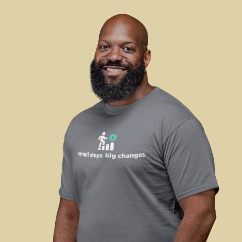 Man in grey shirt smiling
