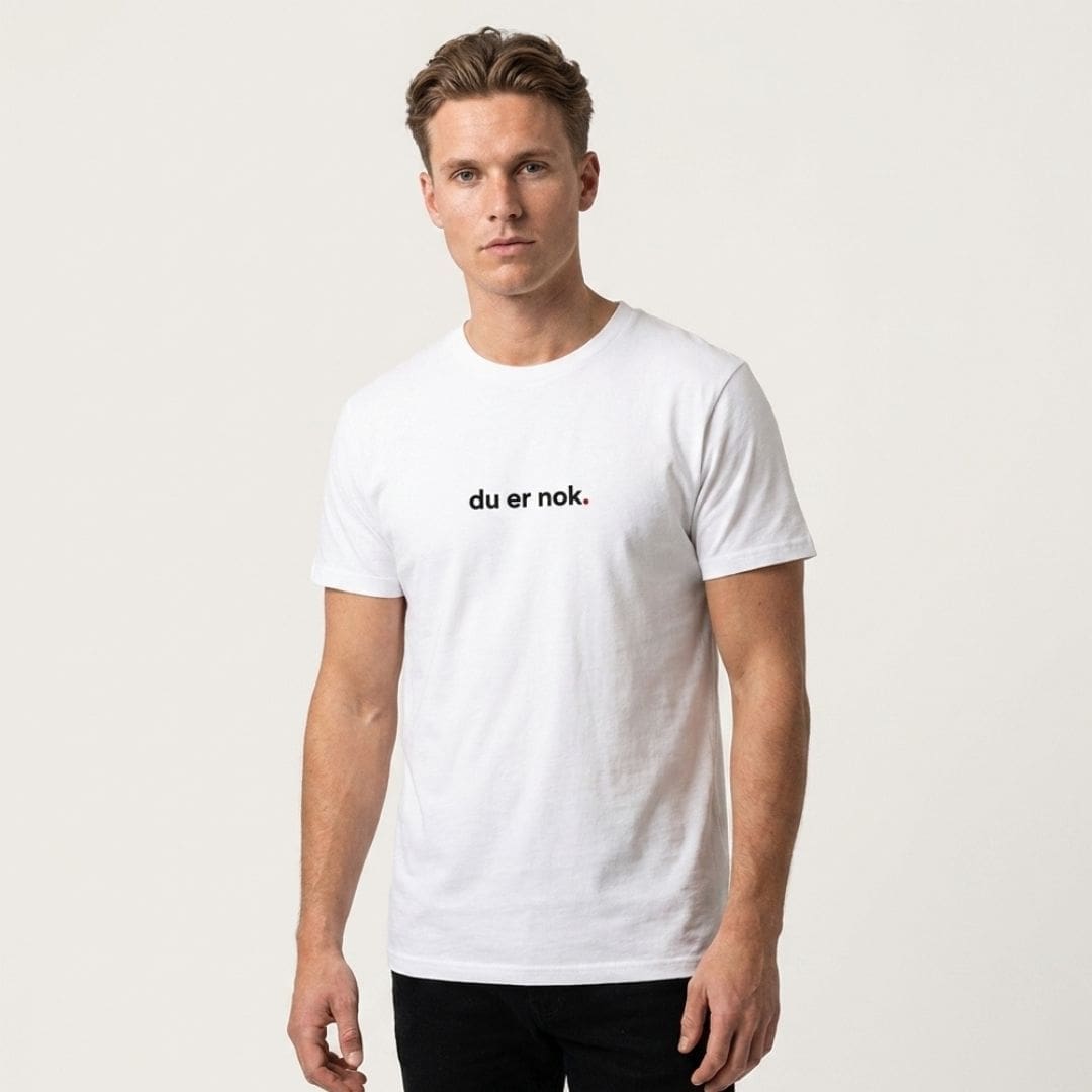 you-are-enough-international-white-tee Man wearing white T-shirt with printed slogan