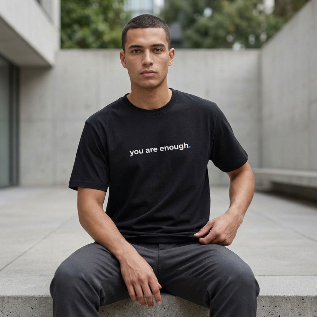 Man wearing 'you are enough' T-shirt