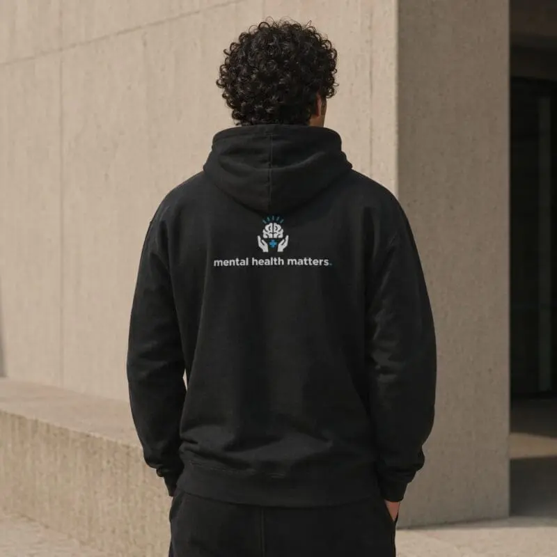 Person wearing hoodie with mental health slogan
