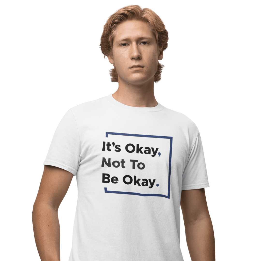 it’s okay not to be okay tee Person wearing T-shirt with motivational slogan.
