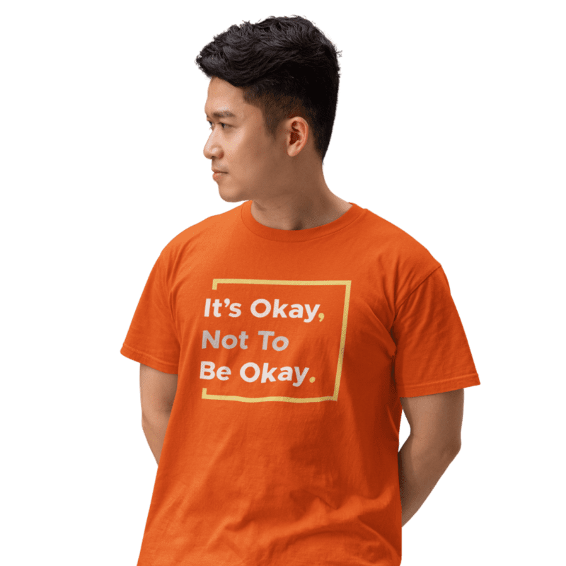 Person wearing 'It's Okay, Not To Be Okay' shirt