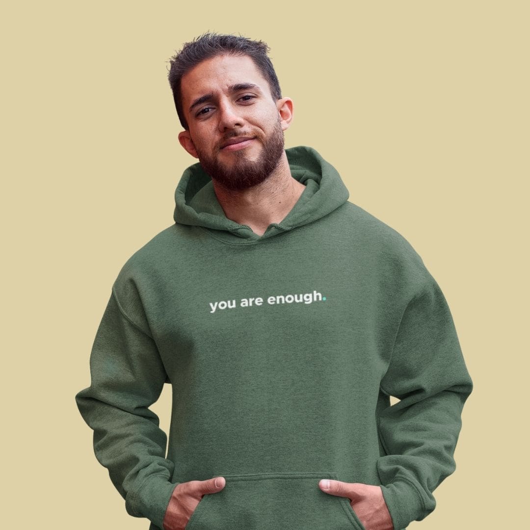 you are enough keep being you hoodie (calm) Person wearing 'you are enough' green hoodie.