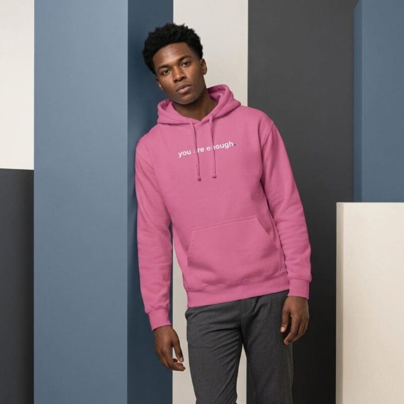 Man in pink hoodie with slogan
