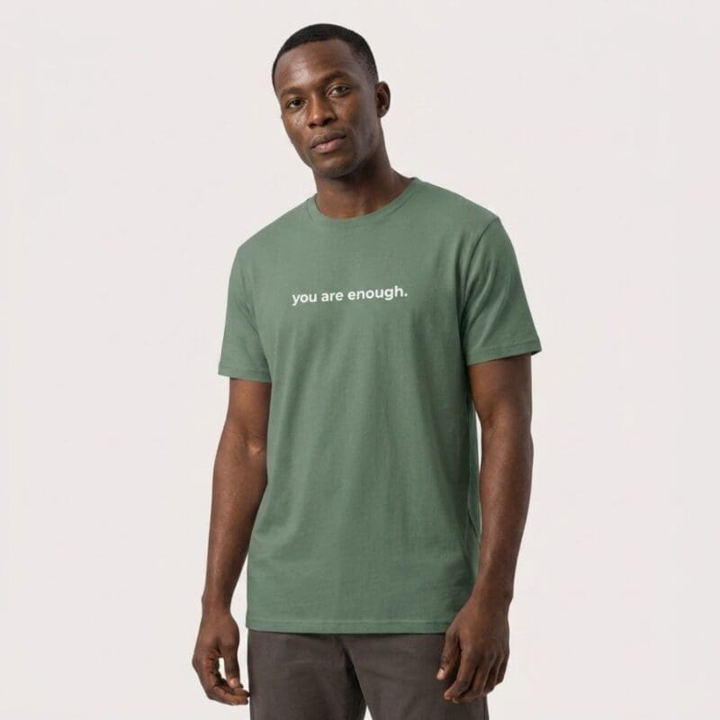 Man wearing green ‘you are enough’ T-shirt