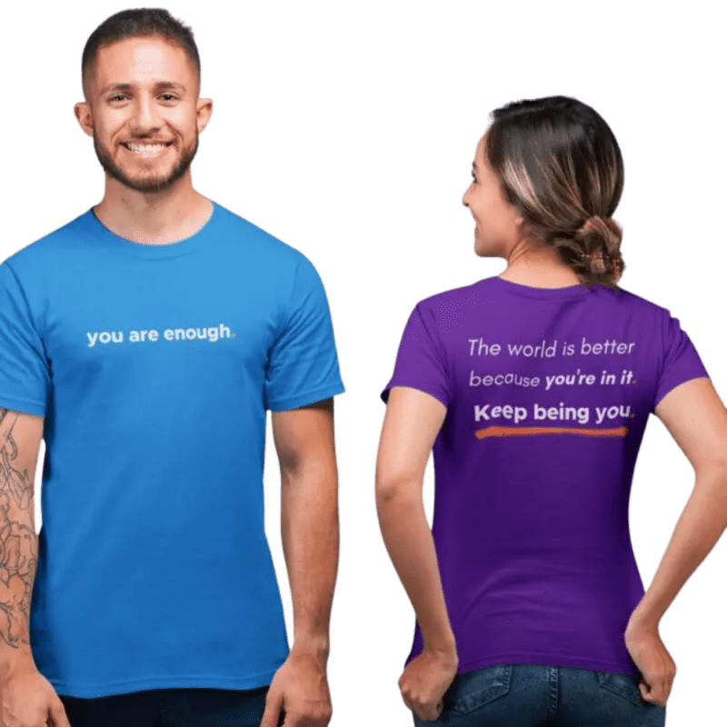 Models wearing motivational phrase t-shirts