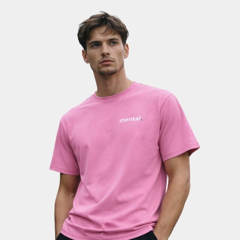 Man wearing pink Mental T-shirt.
