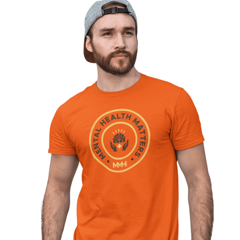 Man wearing 'Mental Health Matters' orange t-shirt.