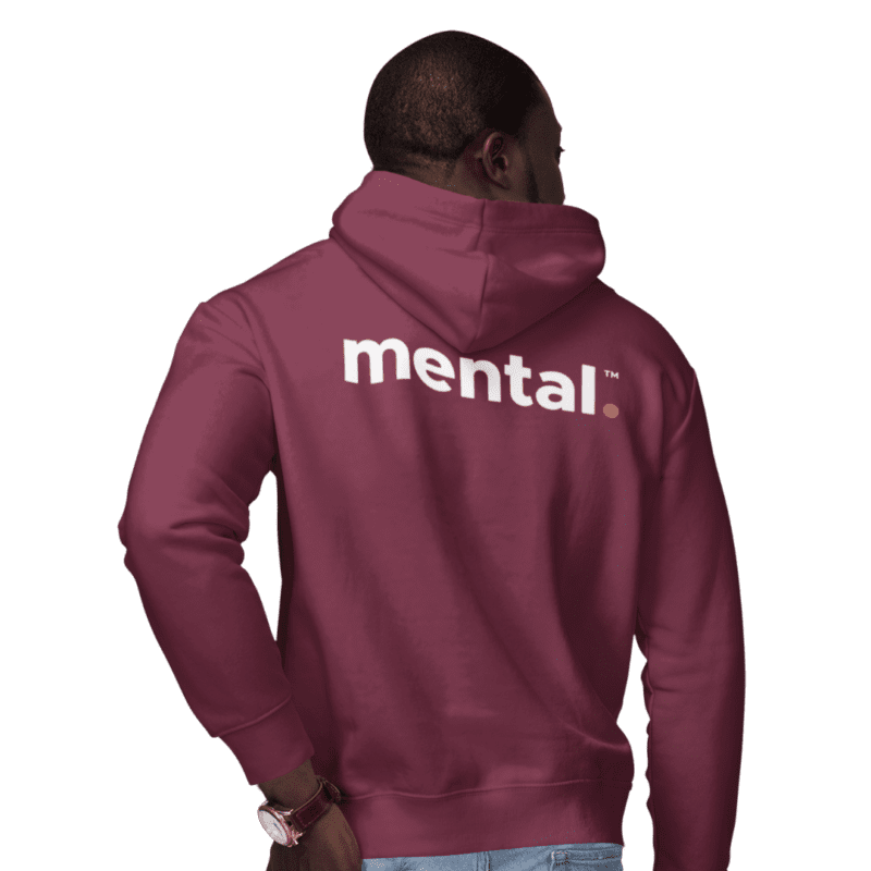 Man wearing maroon Mental hoodie facing backwards.