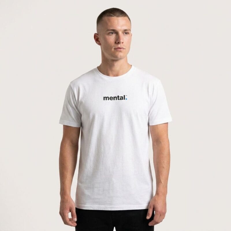Man wearing white 'mental.' slogan T-shirt