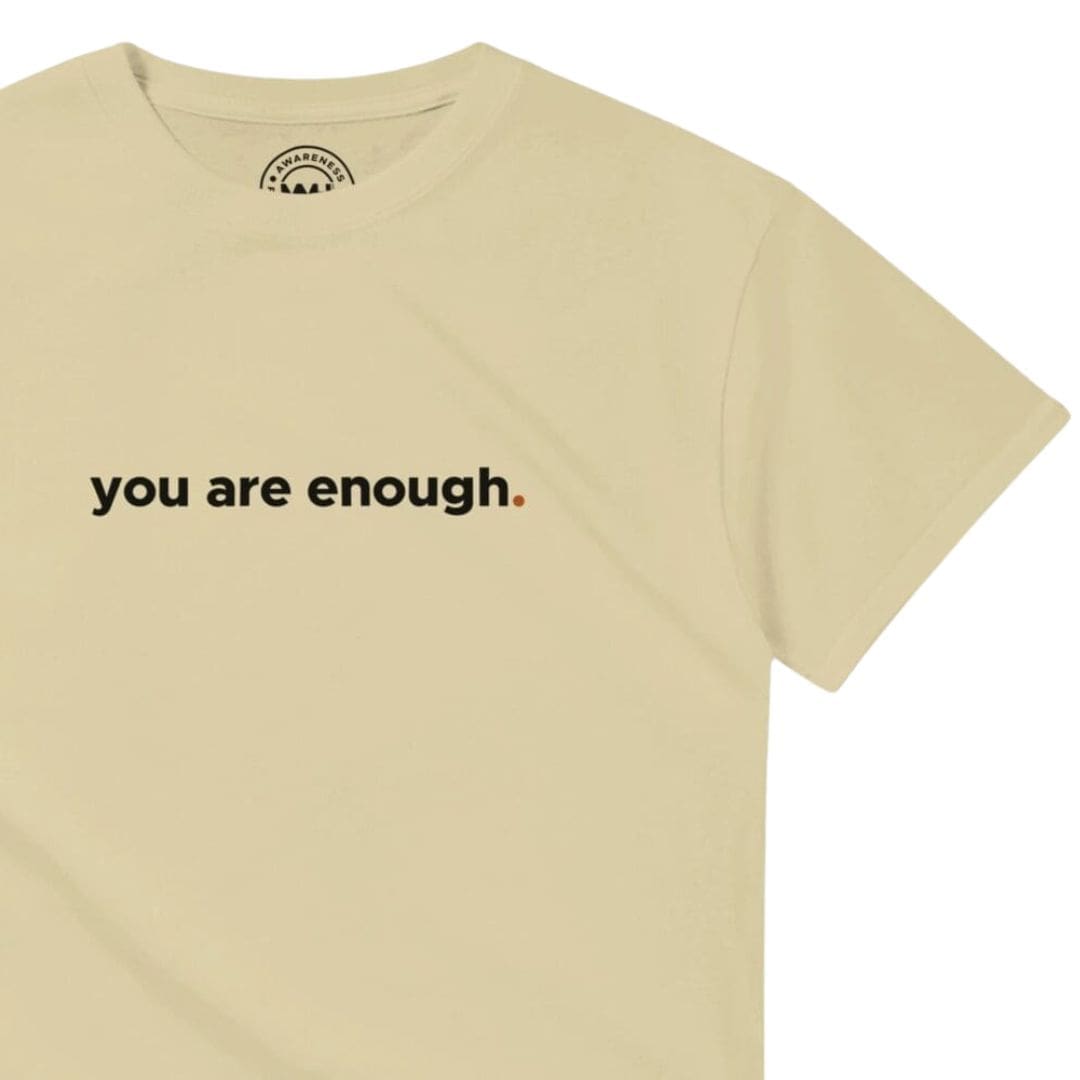 Beige T-shirt with 'you are enough' text.