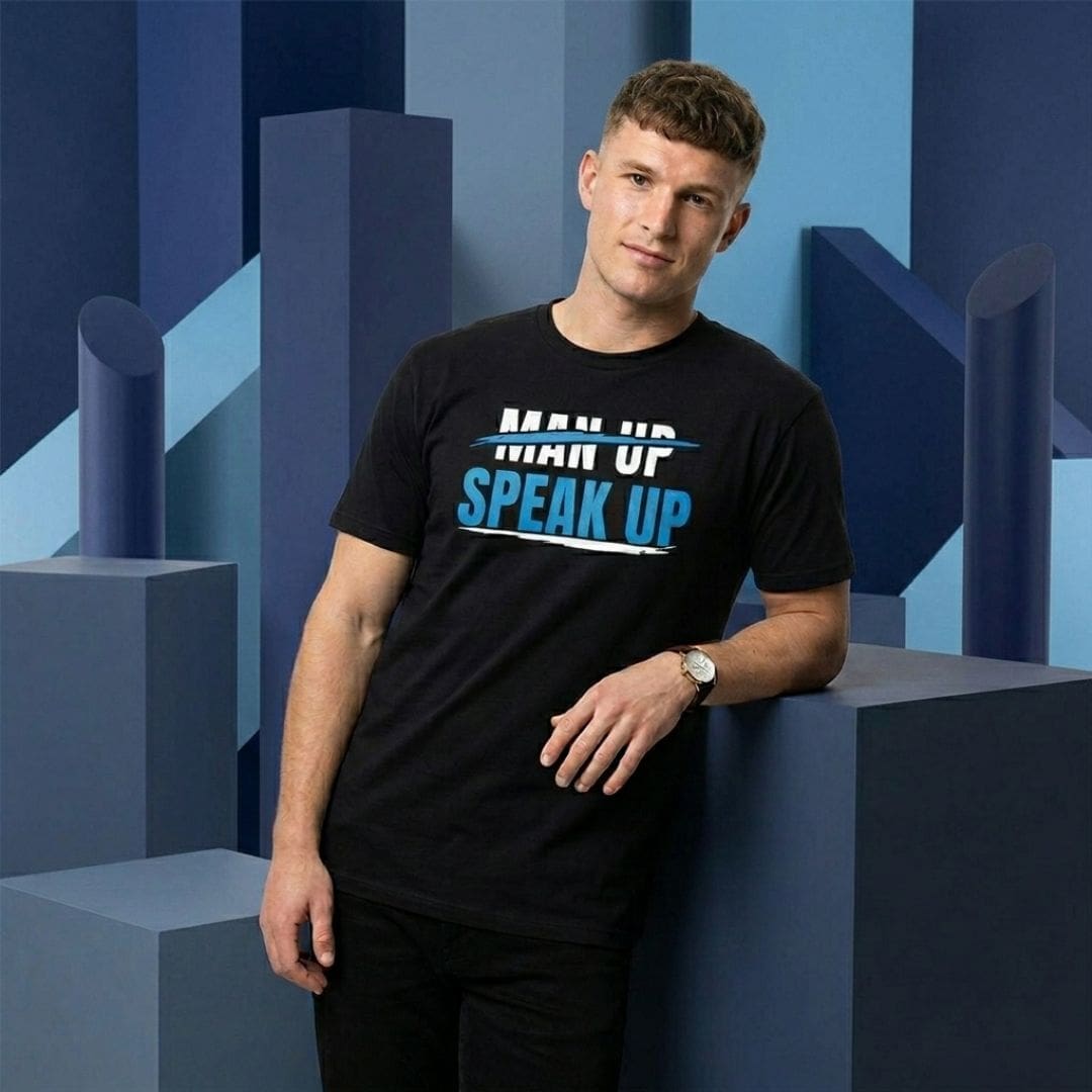 Man wearing 'Man Up Speak Up' T-shirt