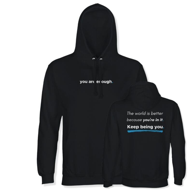Black MMH Clothing “You Are Enough” recycled organic hoodie showing the front and back designs. The front features a small white “you are enough.” chest print, while the back reads “The world is better because you’re in it. Keep being you.” with blue accent details.
