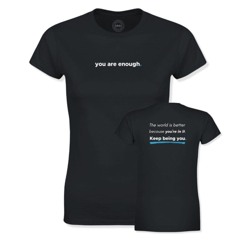 Black women’s MMH Clothing “You Are Enough” T-shirt showing the front and back designs. The front reads “you are enough.” in white with a blue accent dot, while the back features the message “The world is better because you’re in it. Keep being you.” in white with blue accent details.