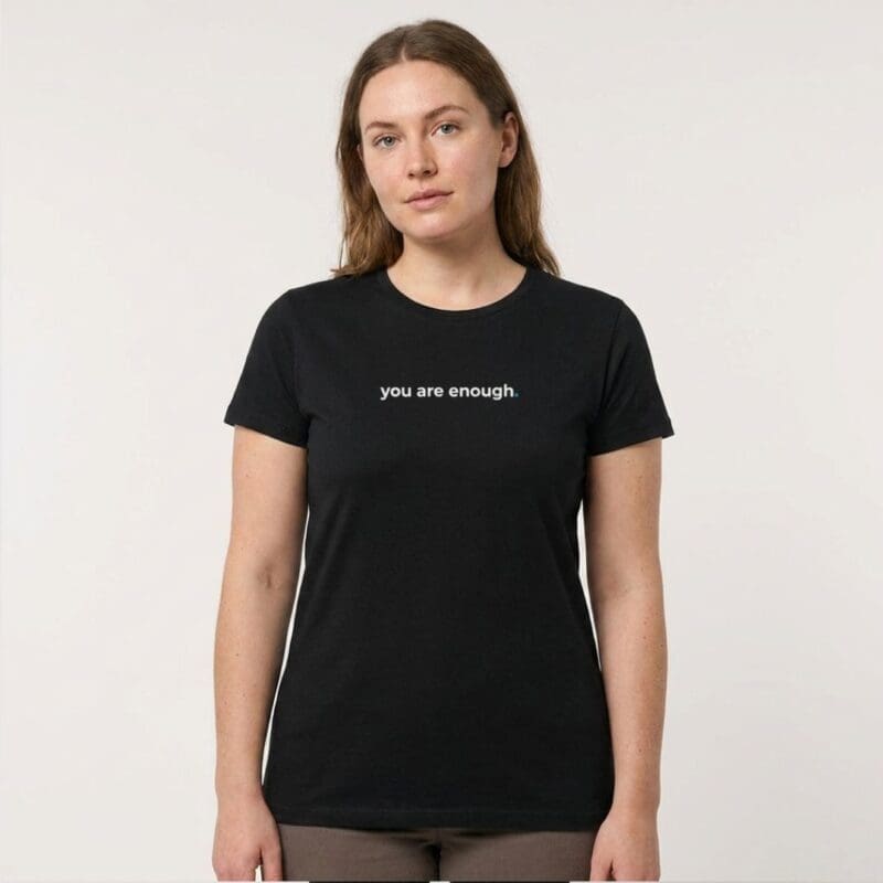 Woman wearing black 'you are enough' T-shirt