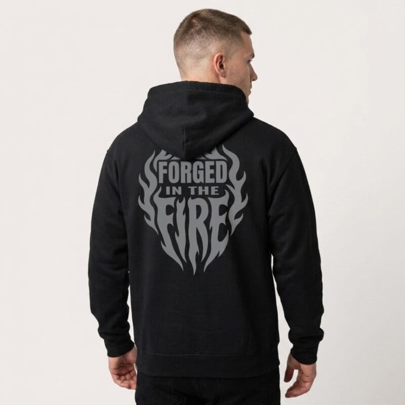 Man wearing black hoodie with flame slogan design