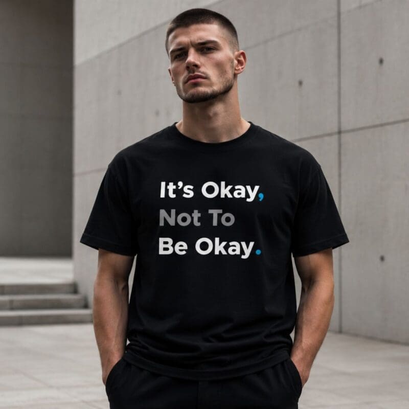 Man wearing mental health slogan T-shirt