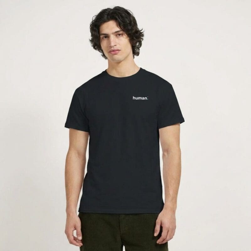 Man wearing black 'human.' slogan T-shirt