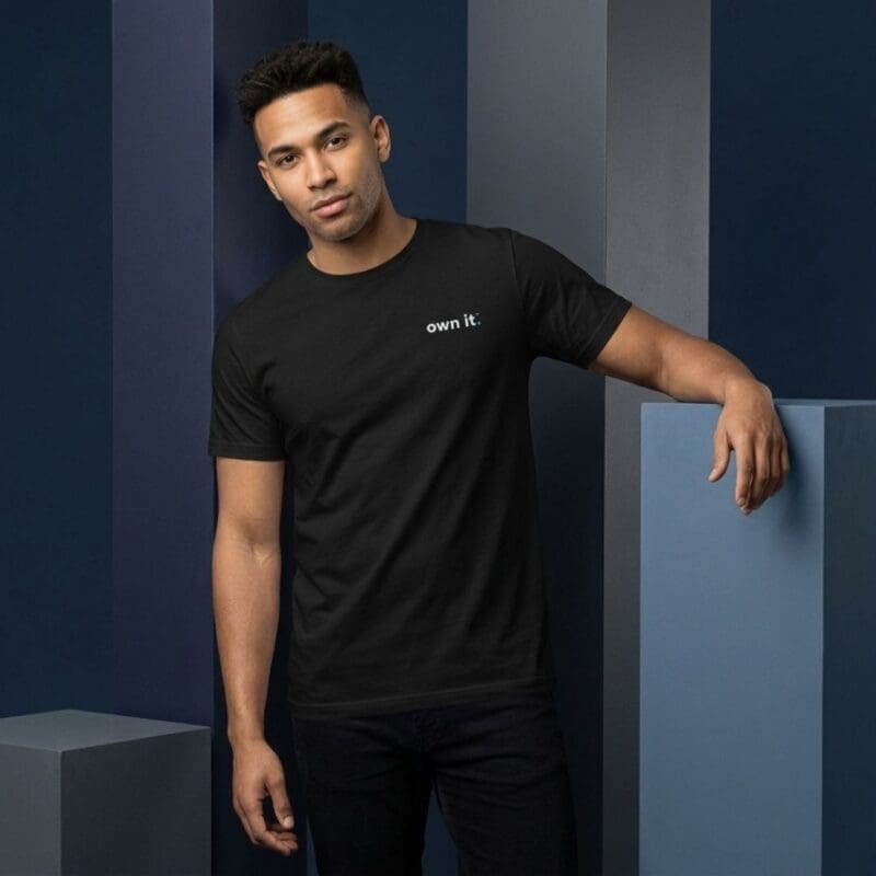 Man wearing black 'own it' T-shirt