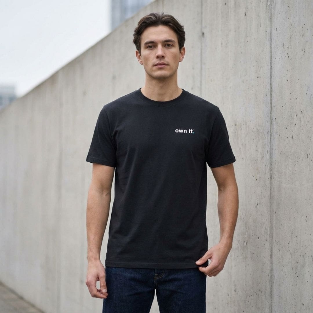 Man wearing black ‘own it.’ slogan T-shirt