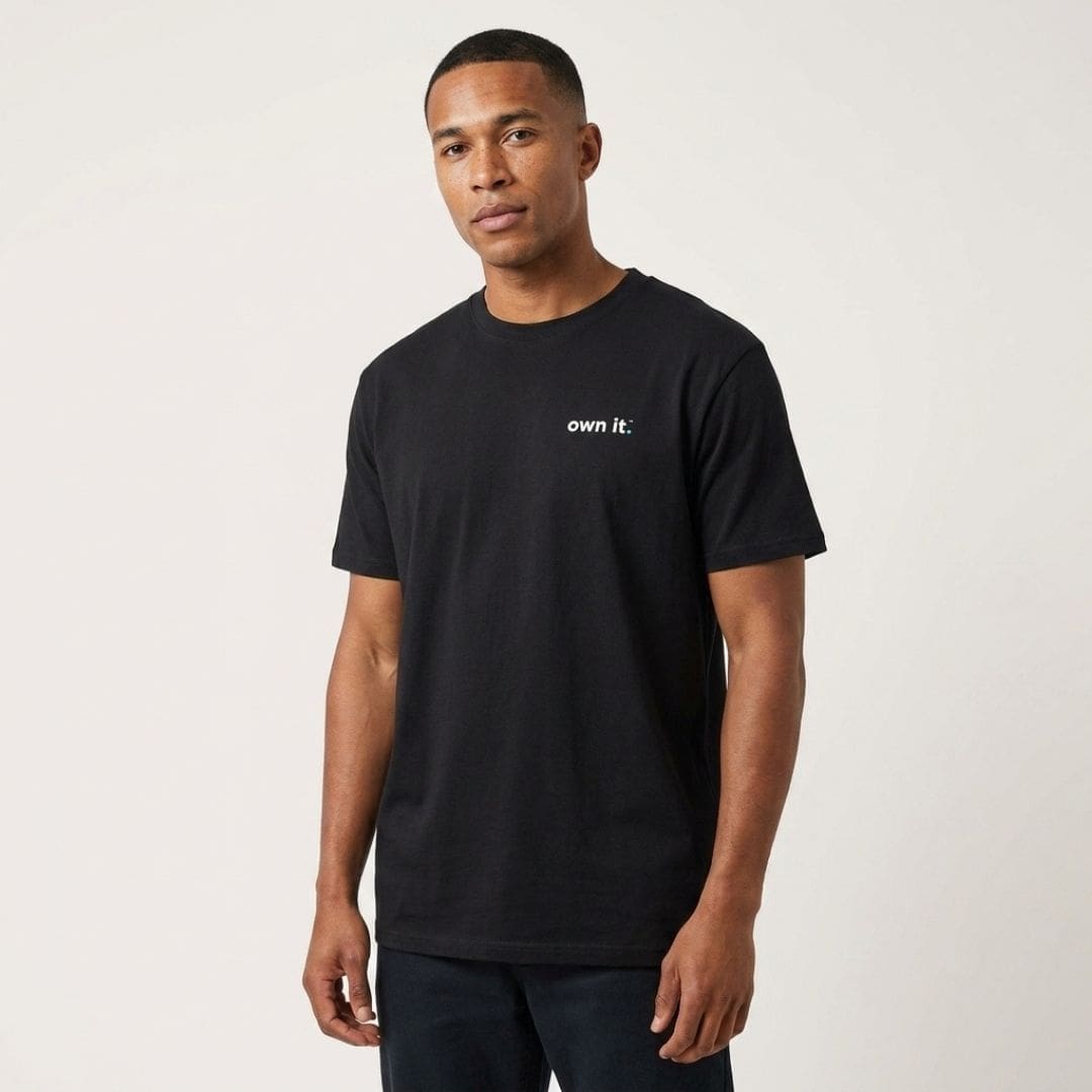 Man wearing black 'own it.' T-shirt