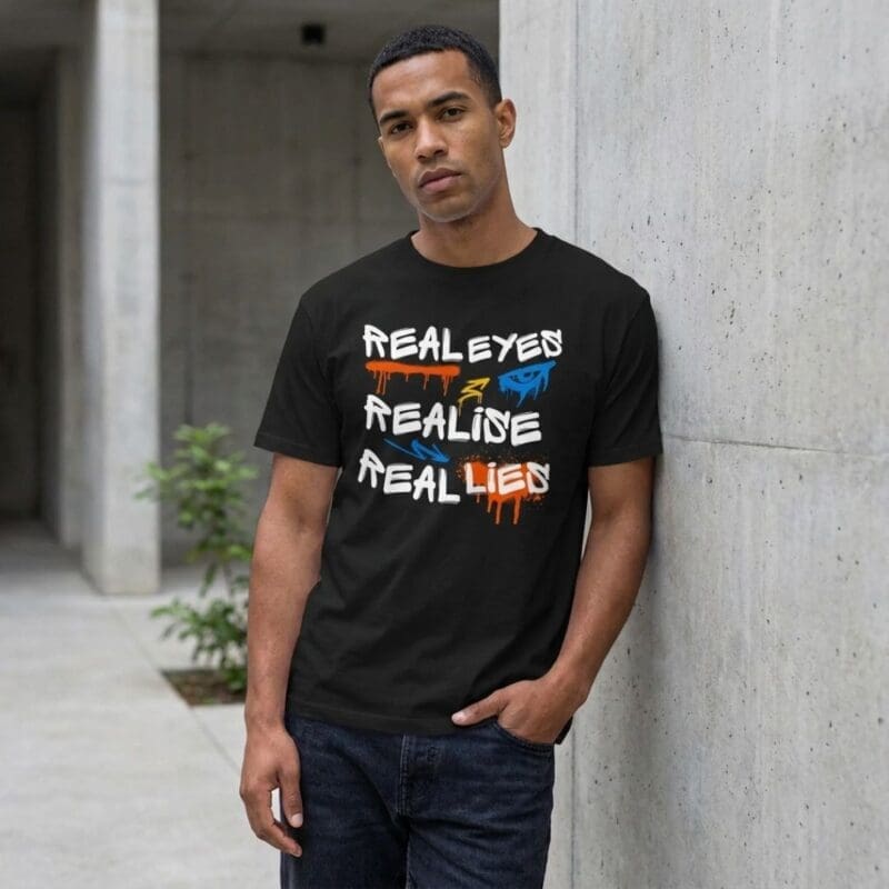 Man wearing 'Real Eyes Realise Real Lies' T-shirt