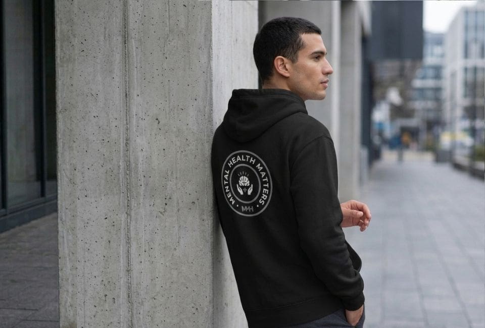 Man wearing Mental Health Matters hoodie outdoors