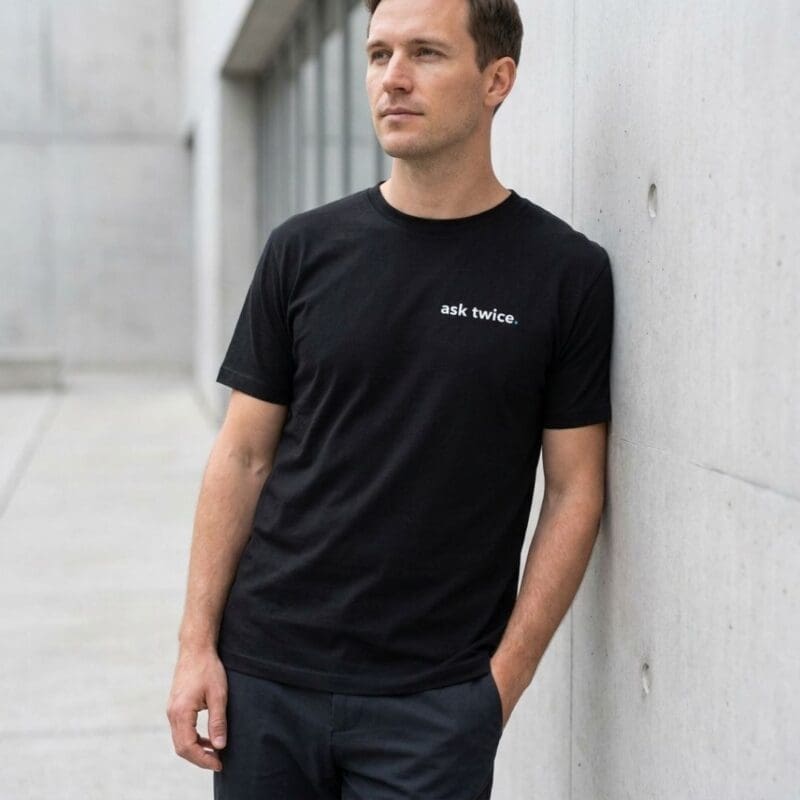 Man in black ‘ask twice’ T-shirt