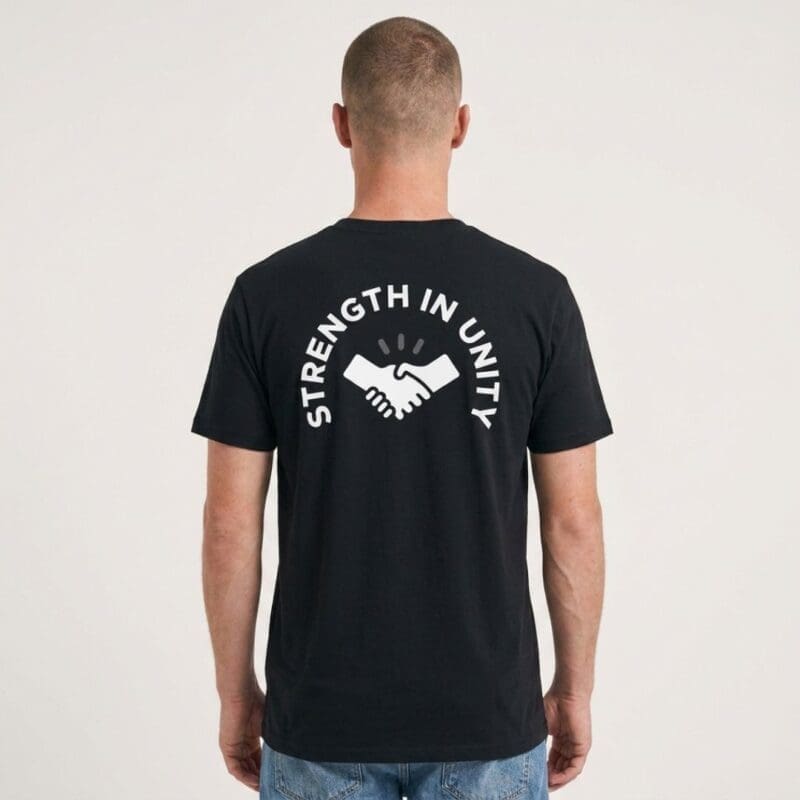 Man wearing black Strength in Unity T-shirt