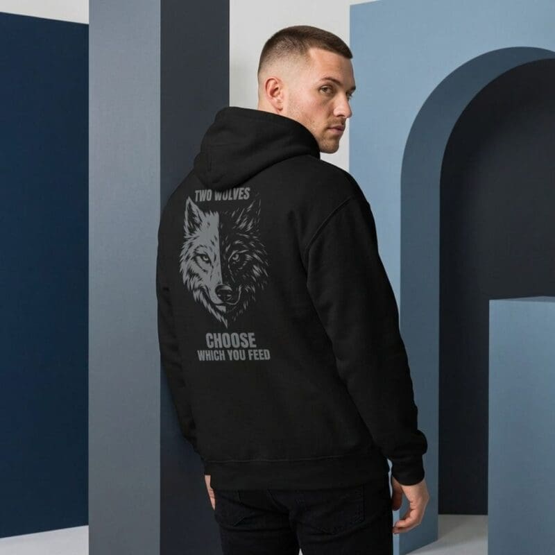 Man wearing black hoodie with wolf graphic