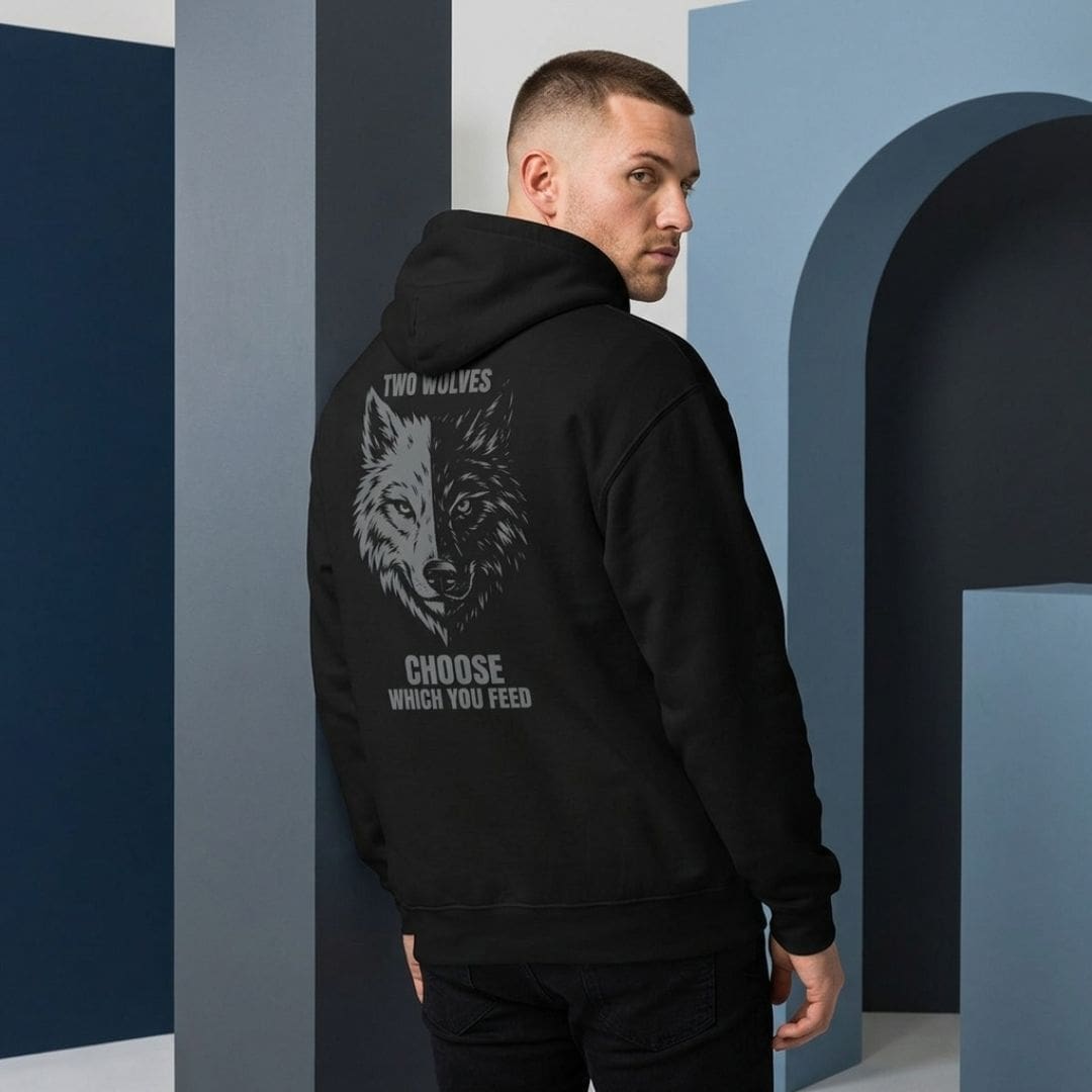 Man wearing black hoodie with wolf graphic